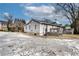 Exterior of home with a view of the cracked driveway and back deck, and a grey exterior with white trim at 2312 Wayside Ne Dr, Brookhaven, GA 30319