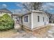 An exterior view of a home with light siding, a small porch and a sidewalk leading up to it at 2312 Wayside Ne Dr, Brookhaven, GA 30319