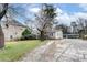 An exterior view of a house, showing a front yard, driveway, and architectural details at 2312 Wayside Ne Dr, Brookhaven, GA 30319