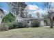 Exterior view of a one story house with lawn and mature landscaping on a sunny day at 2312 Wayside Ne Dr, Brookhaven, GA 30319