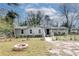 Charming home with a front yard featuring a fire pit and mature trees at 2312 Wayside Ne Dr, Brookhaven, GA 30319