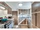 Kitchen featuring hard wood floors, stainless steel appliances, and white and brown wooden cabinets at 2312 Wayside Ne Dr, Brookhaven, GA 30319