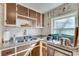 A well-lit kitchen featuring granite countertops, stainless appliances and neutral cabinets at 2312 Wayside Ne Dr, Brookhaven, GA 30319