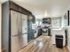 Modern kitchen with stainless steel appliances and dark cabinets, plus wooden floors and a washer/dryer at 2312 Wayside Ne Dr, Brookhaven, GA 30319