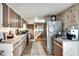 Spacious kitchen with stainless steel appliances, wood look flooring, and lots of cabinet space at 2312 Wayside Ne Dr, Brookhaven, GA 30319