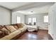 Inviting living room featuring a comfortable couch, hardwood floors, and a well-lit atmosphere at 2312 Wayside Ne Dr, Brookhaven, GA 30319