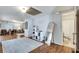 Spacious living room with hardwood floors, soft grey walls, an area rug, and access to a bathroom at 2312 Wayside Ne Dr, Brookhaven, GA 30319