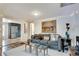Cozy living room featuring neutral colors, a plush gray sofa, and contemporary decor at 2312 Wayside Ne Dr, Brookhaven, GA 30319