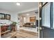 A view from a doorway of a gray sofa, wood floors, and wall art at 2312 Wayside Ne Dr, Brookhaven, GA 30319