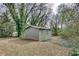 View of the storage shed in the spacious, tree-filled backyard at 2312 Wayside Ne Dr, Brookhaven, GA 30319