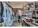 Organized walk-in closet with shelving and rods for ample storage at 2312 Wayside Ne Dr, Brookhaven, GA 30319