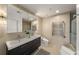 Modern bathroom featuring a double sink vanity, sleek fixtures, heated towel rack, and contemporary design at 3300 Windy Ridge Se Pkwy # 922, Atlanta, GA 30339