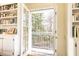 A balcony view looking through french doors framed by built-in bookshelves at 4095 Glen Devon Nw Dr, Atlanta, GA 30327