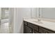 Bathroom vanity featuring a white countertop and dark cabinetry at 4808 Albany Way, Atlanta, GA 30331