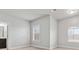 Large bedroom featuring windows with blinds and an attached bathroom at 4808 Albany Way, Atlanta, GA 30331