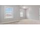 Spacious bedroom featuring windows with blinds and a light colored carpet at 4808 Albany Way, Atlanta, GA 30331