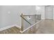Hallway with wood railing and modern lighting leading to the second floor at 4808 Albany Way, Atlanta, GA 30331