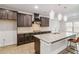 An open kitchen with granite countertops, stainless steel appliances, and pendant lighting at 4808 Albany Way, Atlanta, GA 30331