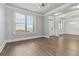 Open-concept living area with hardwood floors, neutral paint, and abundant natural light at 4808 Albany Way, Atlanta, GA 30331