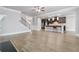 Open floorplan features a kitchen with dark cabinets and a staircase with iron spindles at 4808 Albany Way, Atlanta, GA 30331
