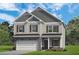 Charming two-story home featuring stone accents, neutral siding, and a two-car garage, set against a blue sky at 174 Silver Leaf Trl, Douglasville, GA 30134