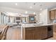 Open-concept kitchen with island and views into the living room at 174 Silver Leaf Trl, Douglasville, GA 30134