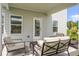 Comfortable covered patio featuring outdoor seating and a view of the backyard at 174 Silver Leaf Trl, Douglasville, GA 30134