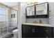 Renovated bathroom with marble shower, dark cabinets, modern fixtures, and a stylish design at 102 Johnson Ct, Decatur, GA 30030