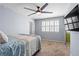 This bedroom features a ceiling fan and a window with light filtering through the shades at 102 Johnson Ct, Decatur, GA 30030