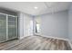 This bedroom features luxury vinyl floors and a glass panel door leading to the outside at 102 Johnson Ct, Decatur, GA 30030