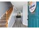 Inviting entryway with wood-look floors, staircase, and a glimpse into the living area, showcasing a welcoming interior at 102 Johnson Ct, Decatur, GA 30030