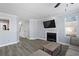 Bright living room featuring hardwood floors, a fireplace, and modern furniture for a comfortable living space at 102 Johnson Ct, Decatur, GA 30030
