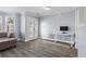 Cozy living room with hardwood floors, natural light, and French doors providing access to outdoor space at 102 Johnson Ct, Decatur, GA 30030