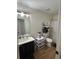 Bathroom featuring vinyl floors, a shower-tub combo, and modern vanity at 10936 Station Dr, Hampton, GA 30228
