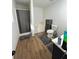 Bathroom featuring vinyl floors, a bathtub, and modern vanity at 10936 Station Dr, Hampton, GA 30228