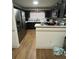 Kitchen featuring granite countertops, stainless steel appliances, and modern cabinets at 10936 Station Dr, Hampton, GA 30228