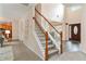 Inviting foyer with staircase leading to the upper level and views of the main level at 2540 Lansing Ln, Cumming, GA 30041