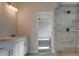 Double vanity bathroom with large tiled shower at 4433 Eastbrook Pl, Snellville, GA 30039