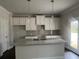 Island kitchen featuring white cabinets and granite countertop at 4433 Eastbrook Pl, Snellville, GA 30039