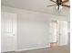 Neutral bedroom featuring a ceiling fan and access to a closet, offering simple comfort at 489 Astoria Way, Mcdonough, GA 30253