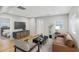 Comfortable living room featuring laminate floors, modern furniture, and natural light at 917 Garibaldi Sw St, Atlanta, GA 30310