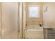 This bathroom features a garden tub, a separate glass shower, and a window at 2160 Berryhill Se Cir, Smyrna, GA 30082