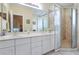 Well-lit bathroom with dual sink vanity, large mirror, and walk-in shower at 2160 Berryhill Se Cir, Smyrna, GA 30082