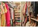 Walk-in closet with built-in shelving for shoes and ample space for clothing at 2160 Berryhill Se Cir, Smyrna, GA 30082