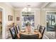 Open dining room with patio access, mirrored wall, and decorative chandelier at 2160 Berryhill Se Cir, Smyrna, GA 30082