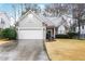 Charming single-Gathering home featuring a two-car garage and well-manicured front yard at 2160 Berryhill Se Cir, Smyrna, GA 30082
