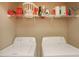 Laundry room with side-by-side washer and dryer and wire shelving for supplies at 2160 Berryhill Se Cir, Smyrna, GA 30082