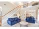 Spacious living room boasts high ceilings, natural light and a staircase leading to the upper level at 2160 Berryhill Se Cir, Smyrna, GA 30082