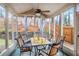 Sunroom with screened windows, ceiling fan, tile flooring and stylish outdoor furniture at 2160 Berryhill Se Cir, Smyrna, GA 30082
