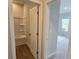 A view into a bathroom featuring a shower-tub combo, with wood-look flooring at 2369 Brown Dove Way (Lot 3), Grayson, GA 30017